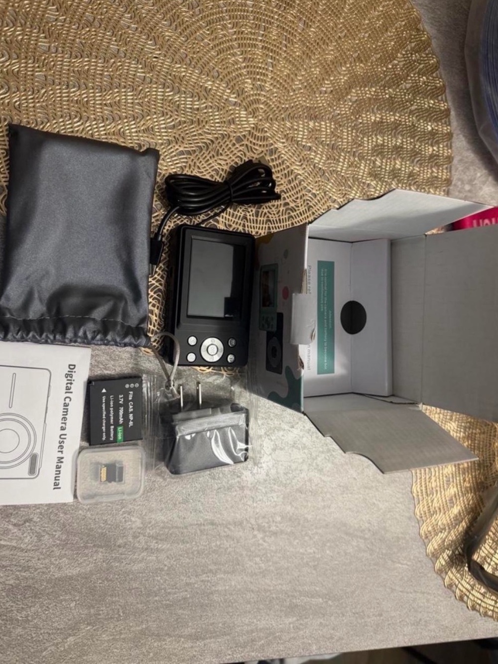Compact Digital Camera with Black Finish and Accessories